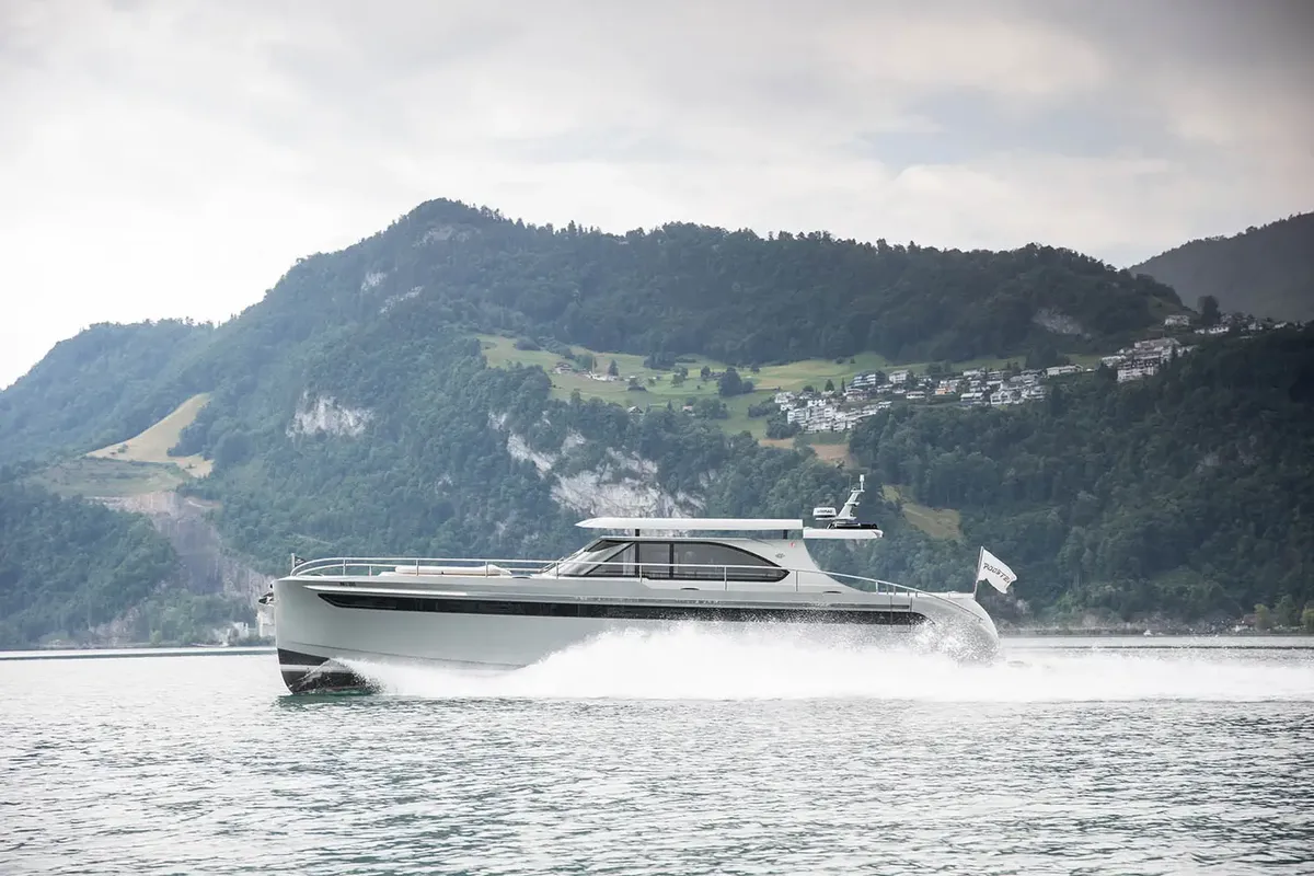 Steeler Yachts 56S: Boat cruising on a lake with mountains