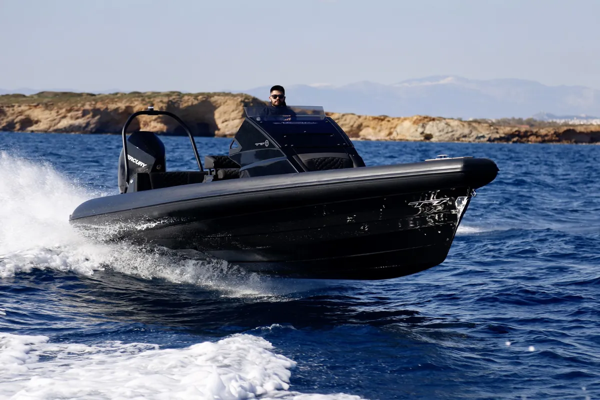 Technohull GT7: Black RIB cruising at sea