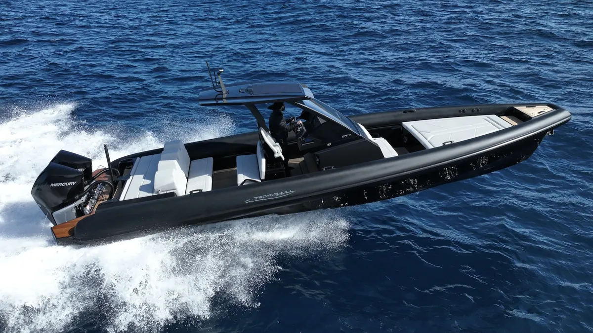 Technohull GTX: Black boat cruising at sea