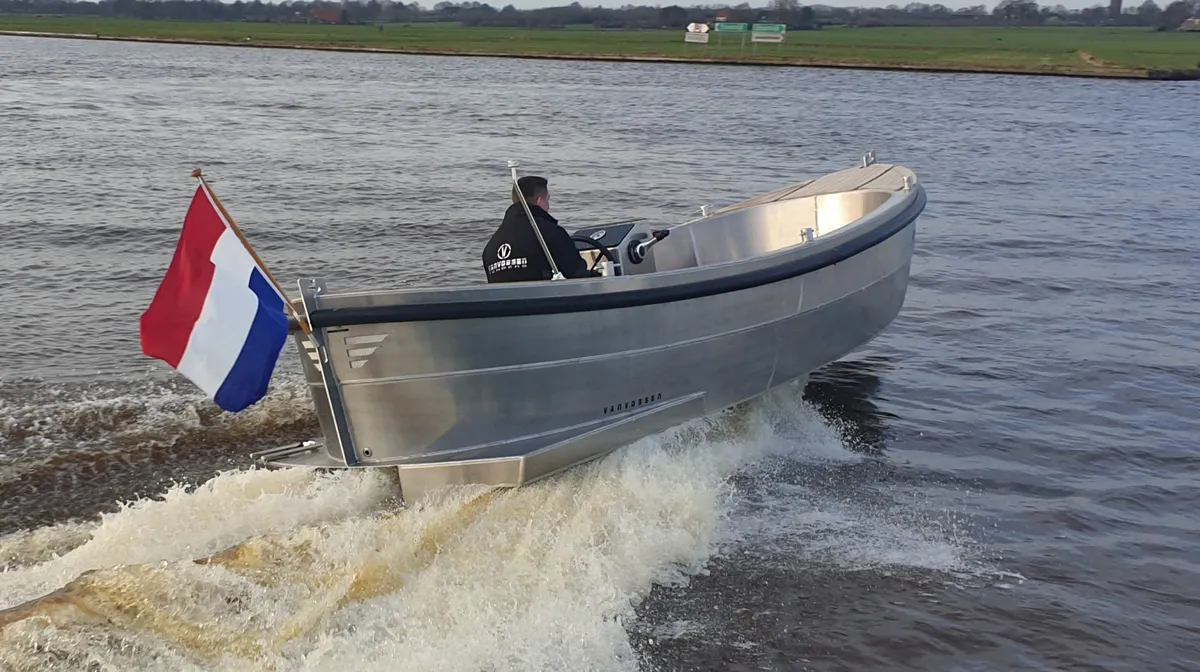 Van Vossen Sloep 600: Aluminium boat cruising on a river