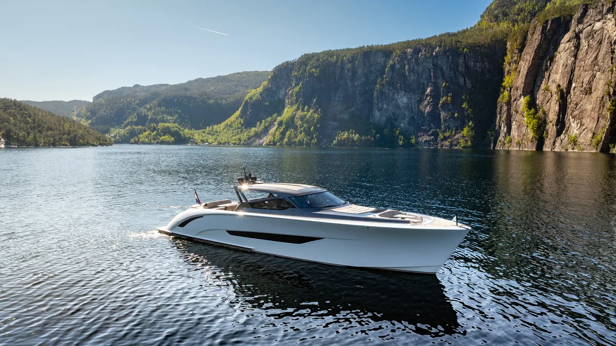 Wajer Yachts 77: White boat cruising in a fjord