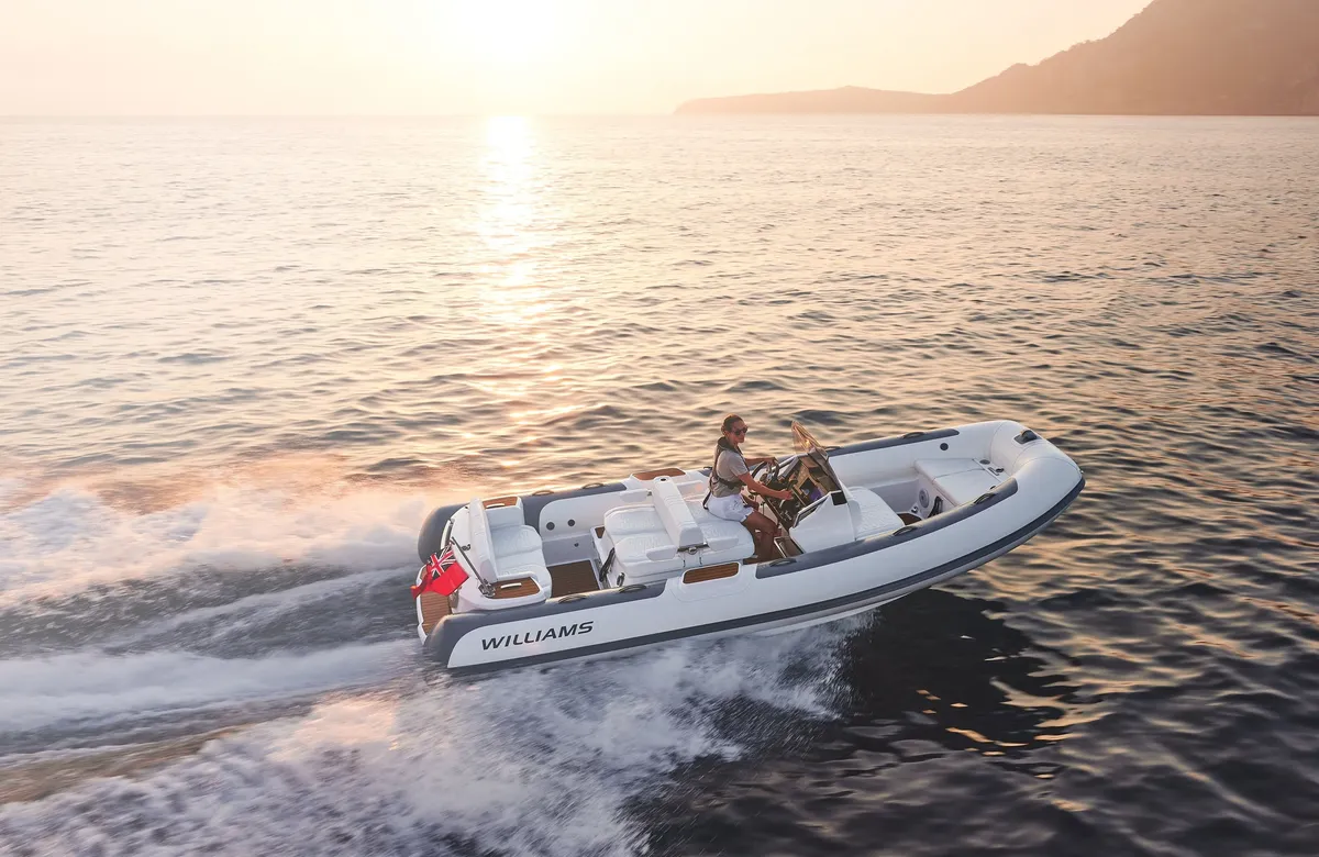 Williams Jet Tenders DieselJet 565: Boat cruising at sea at sunset