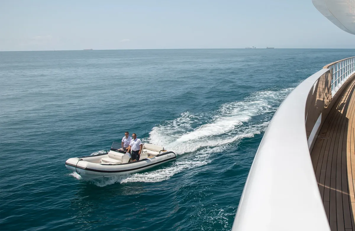 Williams Jet Tenders DieselJet 625: Rubber dinghy cruising alongside a yacht