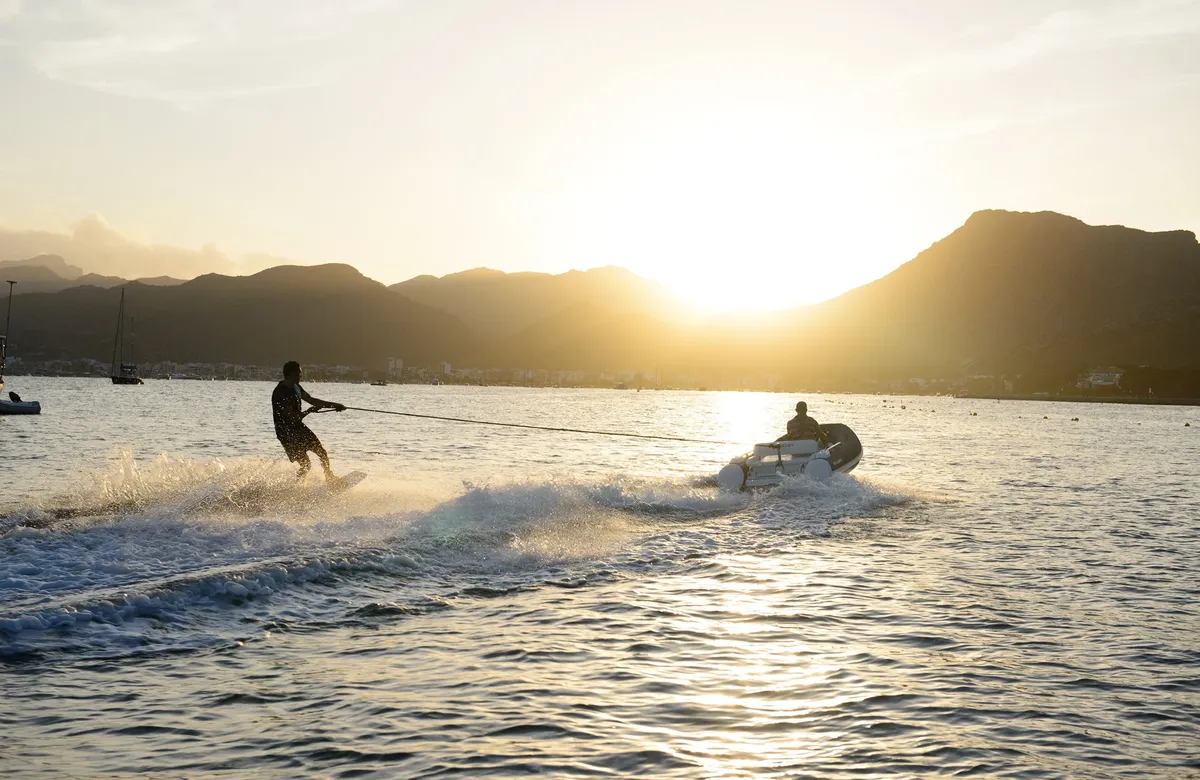 Williams Jet Tenders SportJet 345: Water-skier behind a boat at sunset