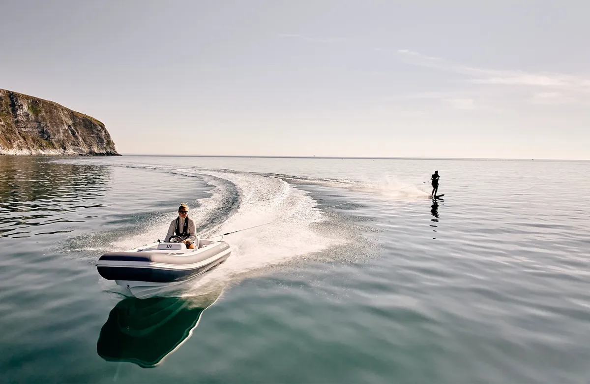 Williams Jet Tenders TurboJet 320MX: Boat towing a water skier at sea