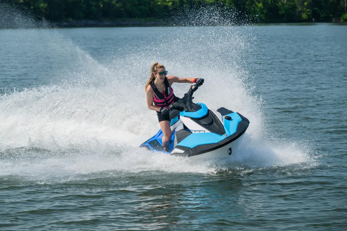 Yamaha WaveRunner JetBlaster DLX: Woman riding a jet ski